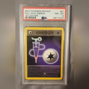 2000 Pokemon Rocket 1st edition Full Heal Energy PSA 8